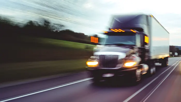 How can you safely pass a big rig?