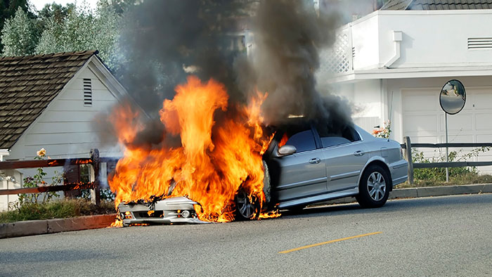 How can severe burns happen during a car accident